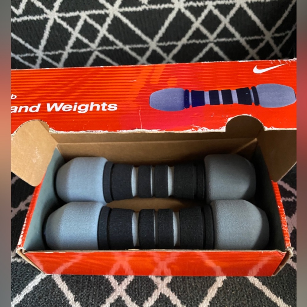 Nike, set of two; 2 lb hand weights. New in box. Never used.